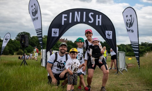 Previous wild walk participants after crossing the finish line