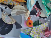 Children make paper crafts with former Surrey Artist of the Year