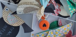 Children make paper crafts with former Surrey Artist of the Year
