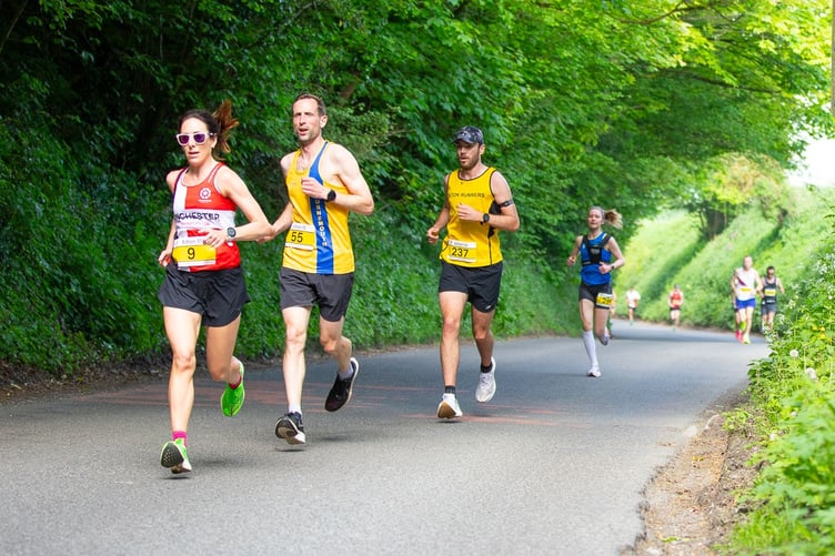 Female winner Tamsin Anderson of Winchester Running Club, Ricky Brennan of Bournemouth AC and Sam Larcombe of Alton Runners (Photo: Douglas MacLean)