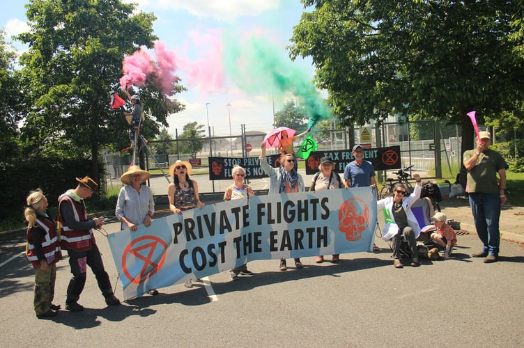 Protesters blocking one of the airport gates in a bid to ban private flights 