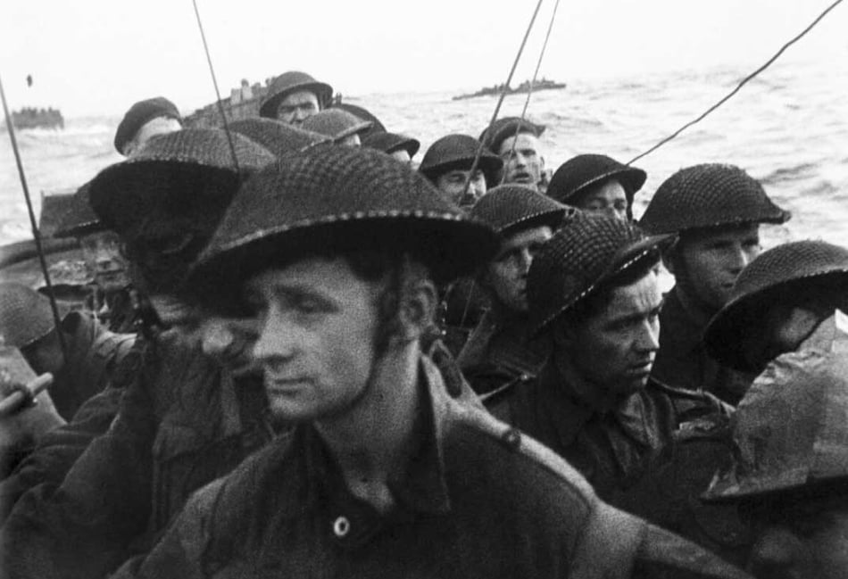 <p>Film still from the D-Day landings showing commandos aboard a landing craft on their approach to Sword Beach, 6 June 1944.</p>