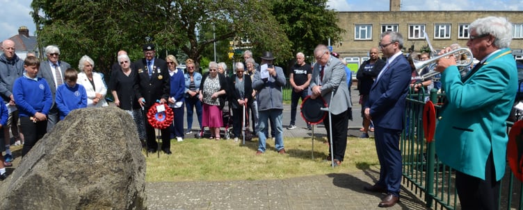 The start of the two minute silence at Westfield. Trevor Curtis of the Midsomer Norton and Radstock Silver Band, sounds the Last Post. (Photo: Will Nicol)