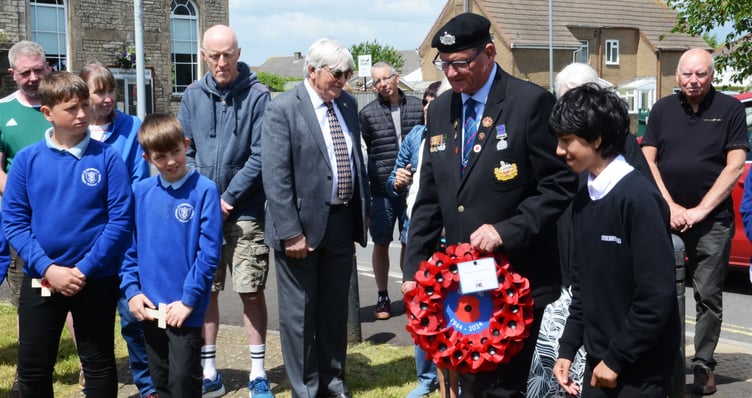 Ex Serviceman Chris Copeland is helped to lay his wreath at Westfield. (Photo: Will Nicol)