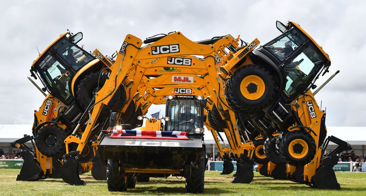 The JCB Dancing Diggers had crowds cheering - and sometimes hiding - as they performed their daring stunts. (Picture: Adrian Jasper)