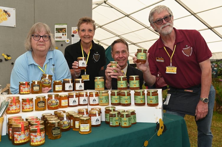 Providing an insight into the life of local bees are Mary (left) and Geoff Hardman (right) of Callington, Vanessa Tyler of Hallworthy and Mark Hoult of Launceston. The Duchy's two Beekeeping Associations (Cornwall and West Cornwall) came together to teach showgoers all about the benefits of bees and supply some tasty, locally sourced honey in the process