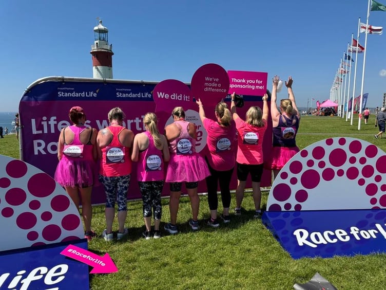 Power runners in pink showing off who they were running for