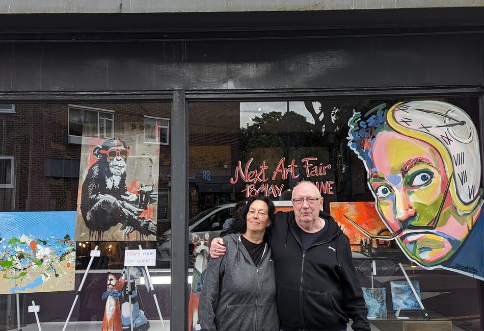<p>Tanya outside Capital Art Gallery in London with owner Karl Sproat</p>