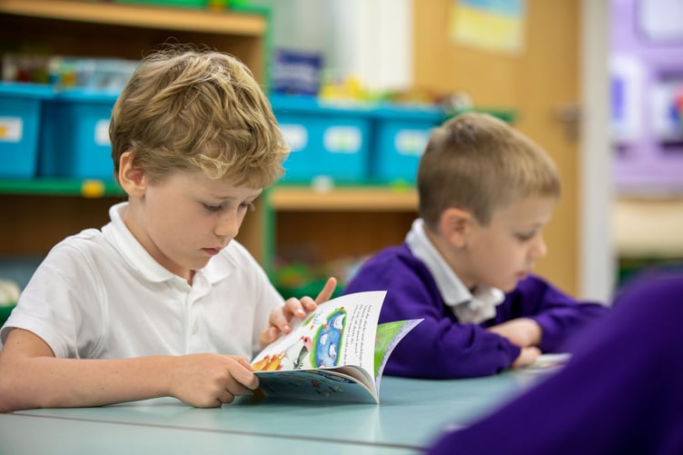 Children reading at William Cobbett Primary School