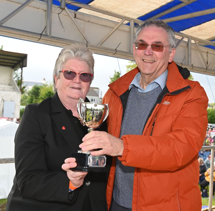 Verlaine Jane presents the Lang Bennetts Cup to Tony Mansell for his dedication to the administration of the festival. Picture: Adrian Jasper