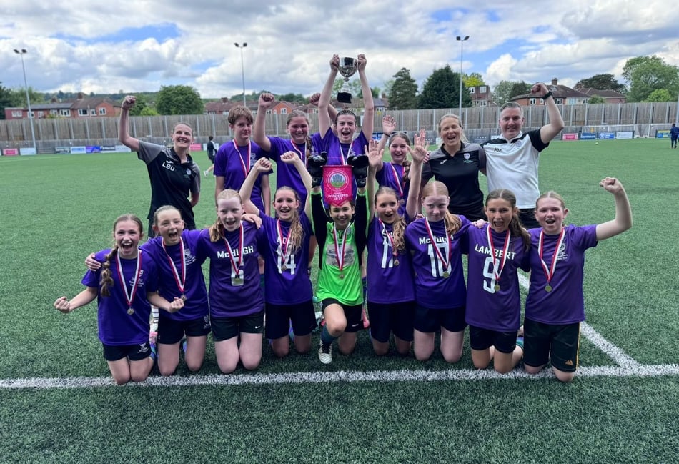 <p>Weydon School's under-13 girls football team celebrate winning the treble (Photo: Weydon School)</p>