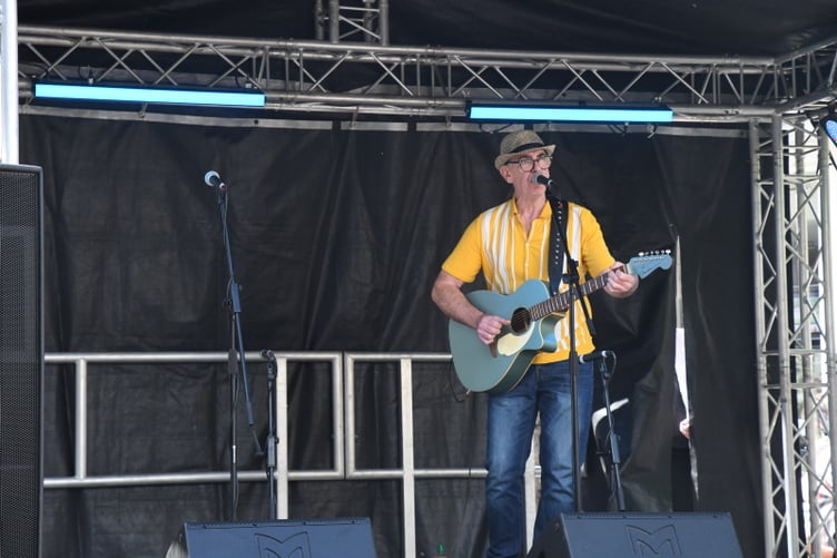 Local singer Rob Davies on the stage in High Street