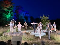Star-crossed lovers under a starlit sky at Shakespeare festival