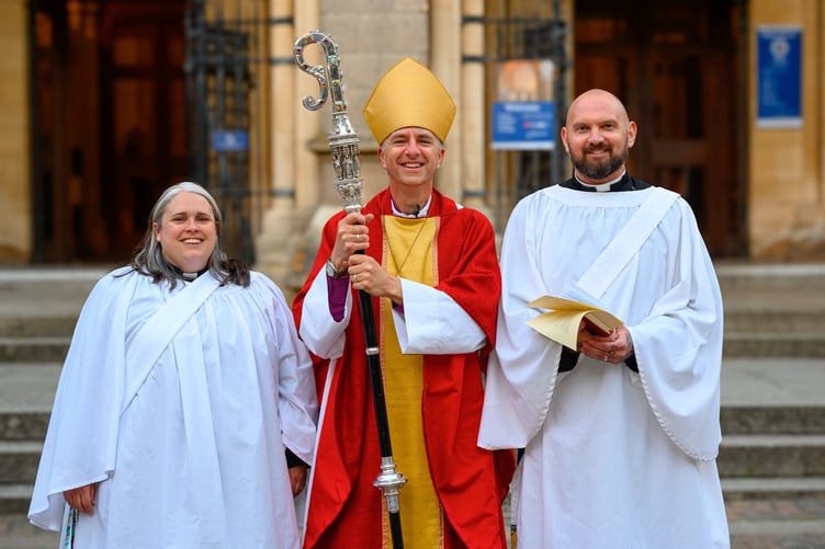 Newly ordained deacons Grace Kanungha and Olly Myles with Bishop Hugh