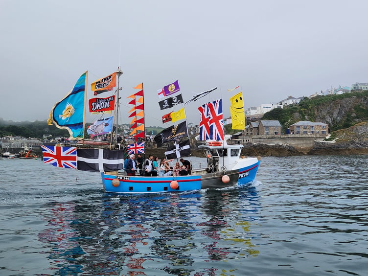 A colourful display from a fishing boat taking part in the feast week celebrations. Picture: James Mustoe