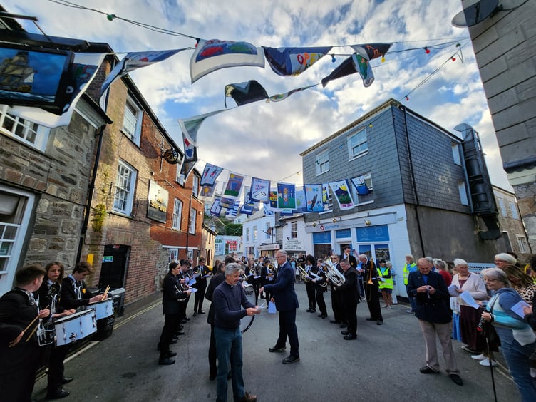 Hymn singing with St Austell Town Band and the Rev Paul Benney. Picture: James Mustoe