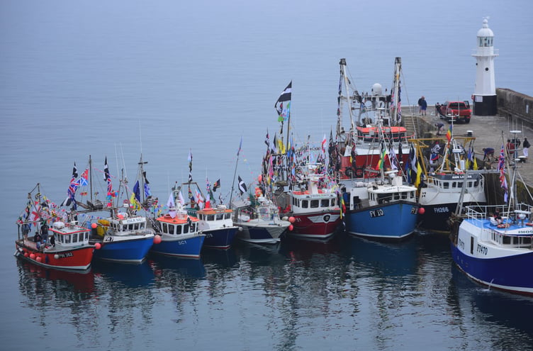 Colourful fishing boats decorated with flags for the boat parade. Picture: Lisa MacLeod