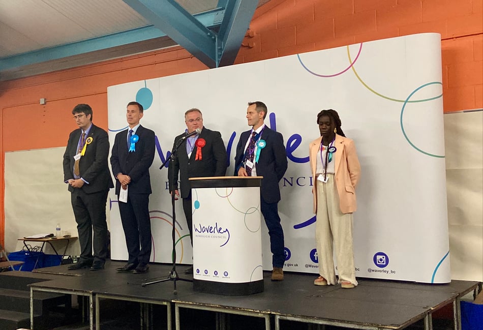 <p>Left to right: Paul Follows, Jeremy Hunt, James Walsh, Graham Drage and Harriet Williams on stage for the Godalming and Ash result.</p>