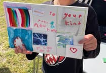 Children create cards to welcome new residents to Brightwells Yard in Farnham