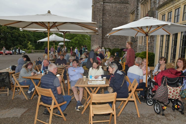 Visitors to Holcombe Rogus Church Fete enjoyed afternoon teas sheltered from the damp weather. PHOTO: Alain Lockyer.