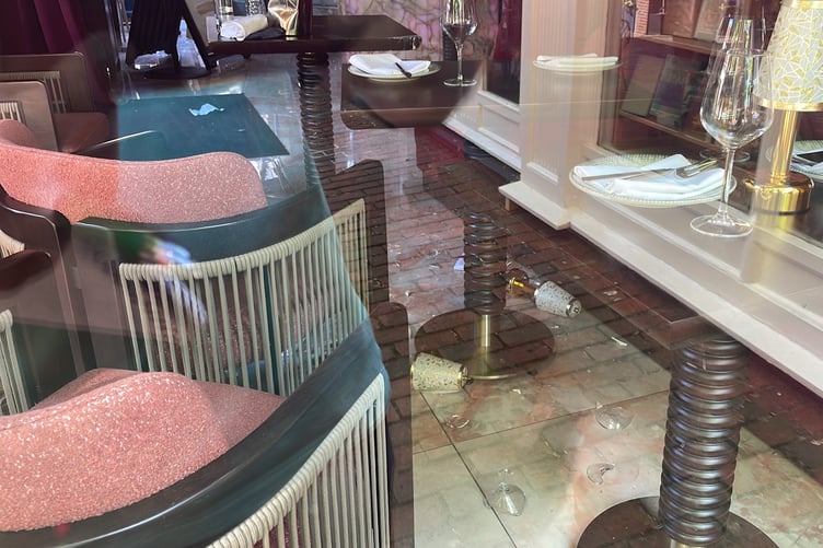 Damaged glasses and lampshade on the inside of the Luxe