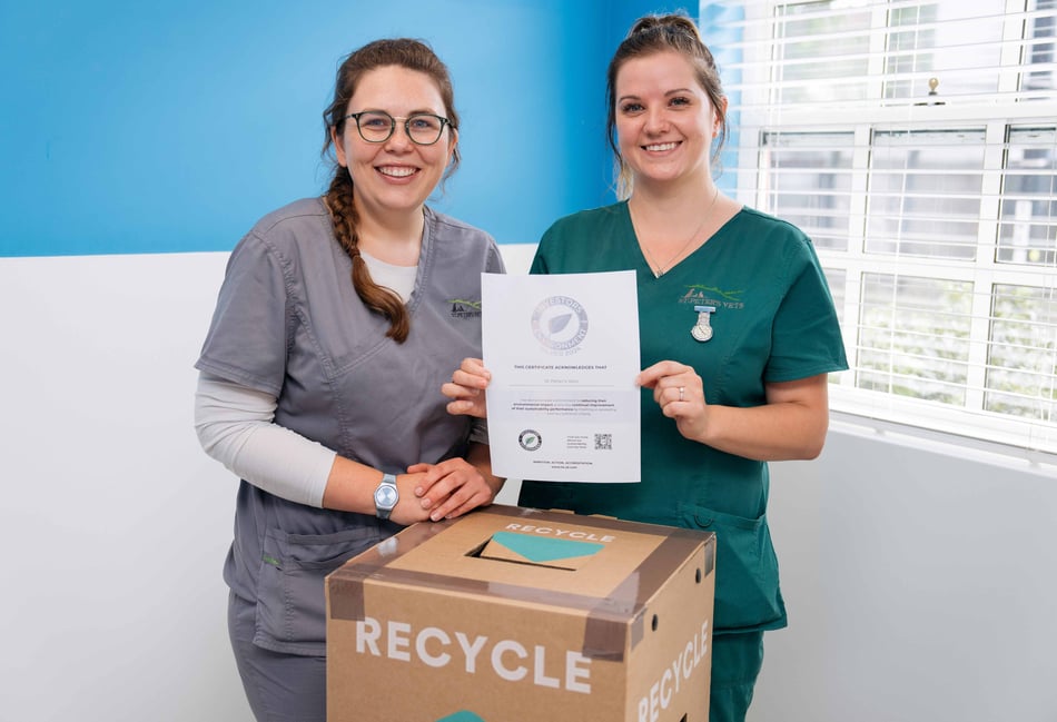 <p>Vet Ella Townsend and veterinary nurse Abi Hayes with St Peter's Vets Silver iiE certificate</p>
