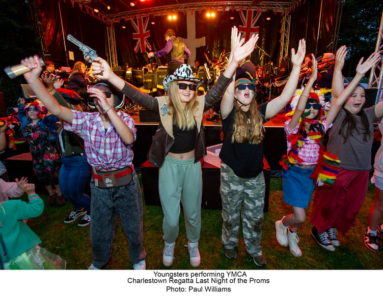 Youngsters performing YMCA at Charlestown Regatta