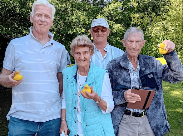 Fitzhead duck race winner Jennifer Irish, centre, with Doug Ranson, right, in second place, Roger Mitchinson, left, in third place, and organiser Martin Irish, back. PHOTO: Sue Mitchison.