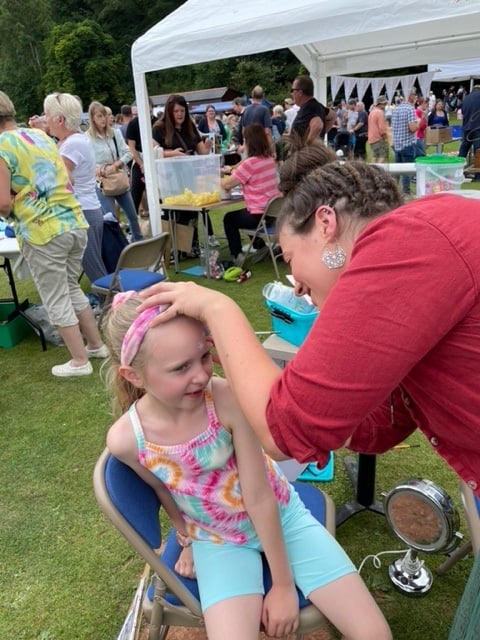 Face painting for young visitors to Roadwater Fete.