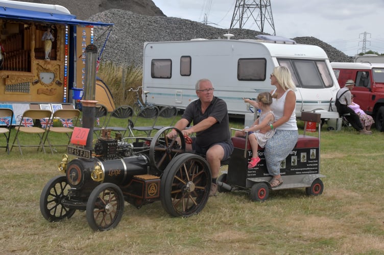 Family rides behind a miniature traction engine. PHOTO: Alain Lockyer.