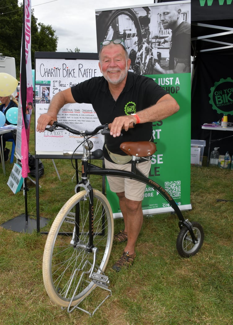 Ben Pickering was raffling off a penny farthing to raise funds for the National Downs Syndrome Society. PHOTO: Alain Lockyer.