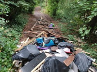 Asbestos and building waste dumped by fly-tippers