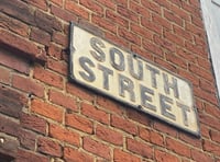 Woman charged with outraging public decency on South Street