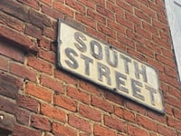 Woman charged with outraging public decency on South Street