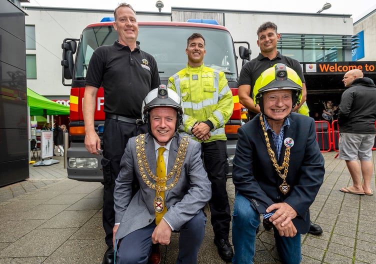 Mayor Julian Young and deputy mayor Colin Hamilton with members of St Austell Fire Brigade. Picture: Paul Williams