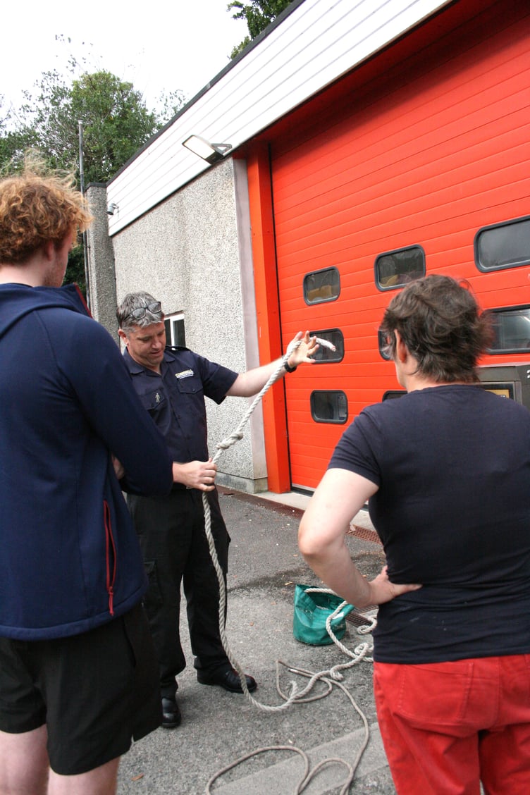 Firefighter Luke demonstrates a figure-of-eight knot