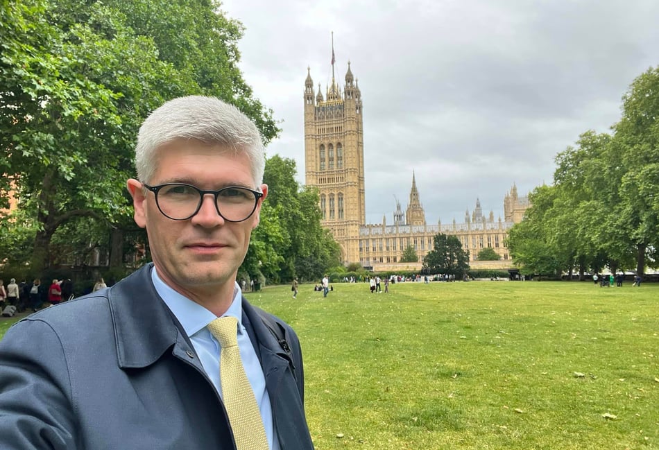 <p>Dr Pinkerton outside the Houses of Parliament.</p>