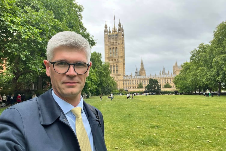 Dr Pinkerton outside the Houses of Parliament