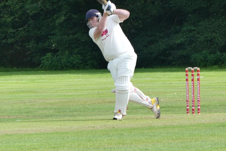 Waverley batter Jim Wright hits a drive to the boundary