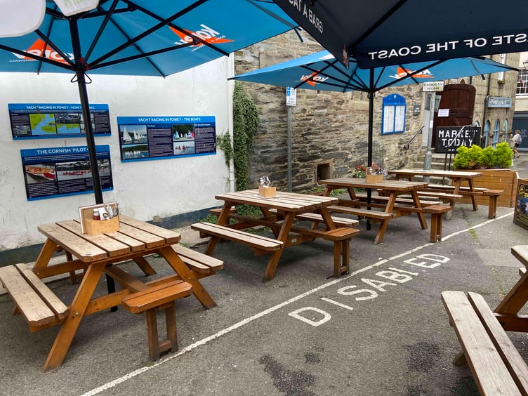 Cornwall Council granted the Ship Inn a licence for the outdoor dining area in the centre of Fowey. Picture: Andrew Townsend