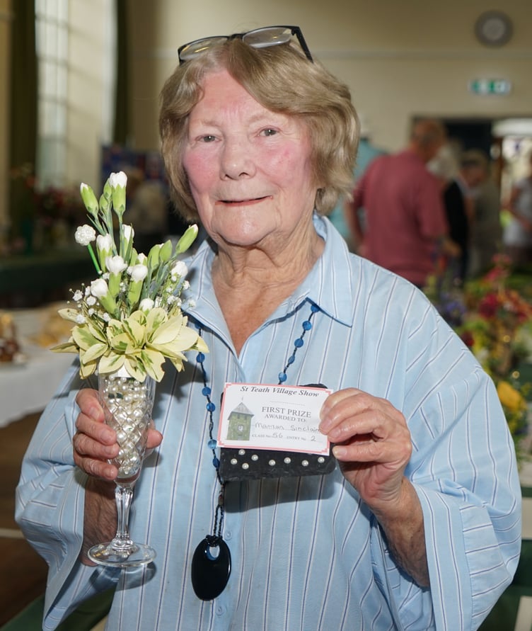 Marian Sinclaire takes first prize with her flower arrangement in a Champagne Flute (Picture: Adrian Jasper)