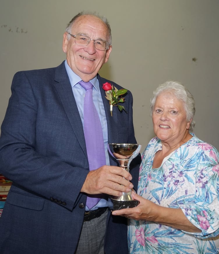 Show President Bob Fox presents the trophy for best cut flowers in the show to Lorraine Jasper (Picture: Adrian Jasper)