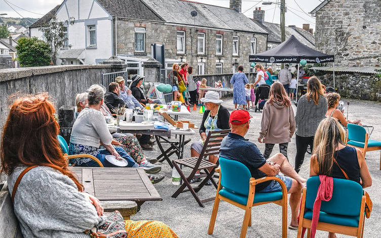 People enjoying the event and free pizzas supplied by Francesco Rigolli’s School of Dough CIC. Picture: Derek Williams