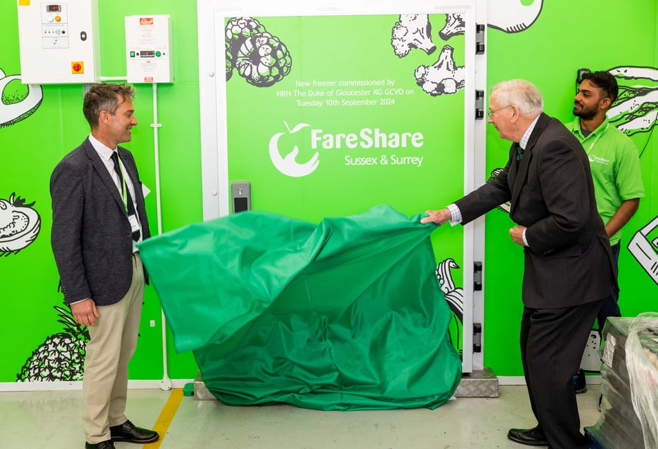 <p>CEO Dan Slatter with the Duke of Gloucester as he unveils one of the plaques (FareShare Sussex & Surrey)</p>