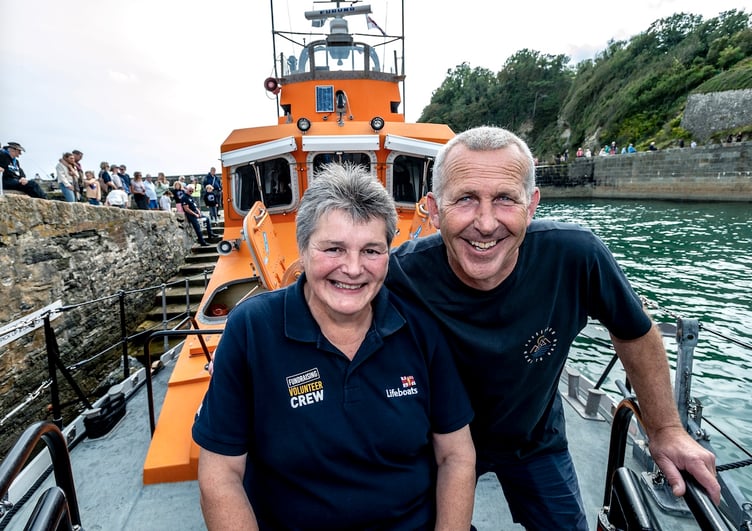 St Austell and District RNLI branch secretary Christine Bone with Fowey Lifeboat coxswain Jonathan Pritchard. Picture: Paul Williams