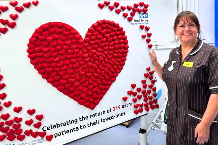 Jo Mountjoy with the hearts representing the patients who went home to their loved-ones