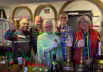 VIDEO: Glasses raised in The Barley Mow after villagers in The Sands buy their local