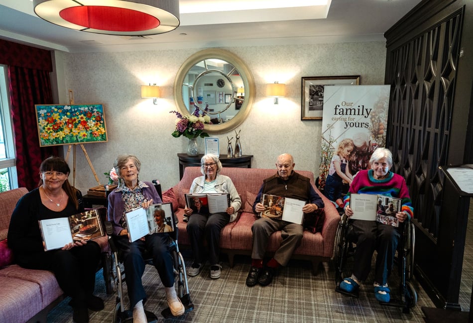 <p>Janet, second left, with other residents and staff who have had recipes published (Bramshott Grange)</p>