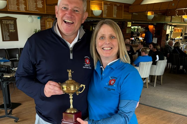 Petersfield Golf Club captain Simon Baigent presents Team Blue’s Katie Laud with the Challenge Trophy