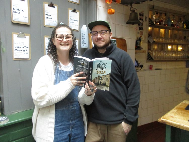 Becca and Luke Cassidy with the Good Beer Guide 2025, Cassidy's, High Street, Alton, October 2024.